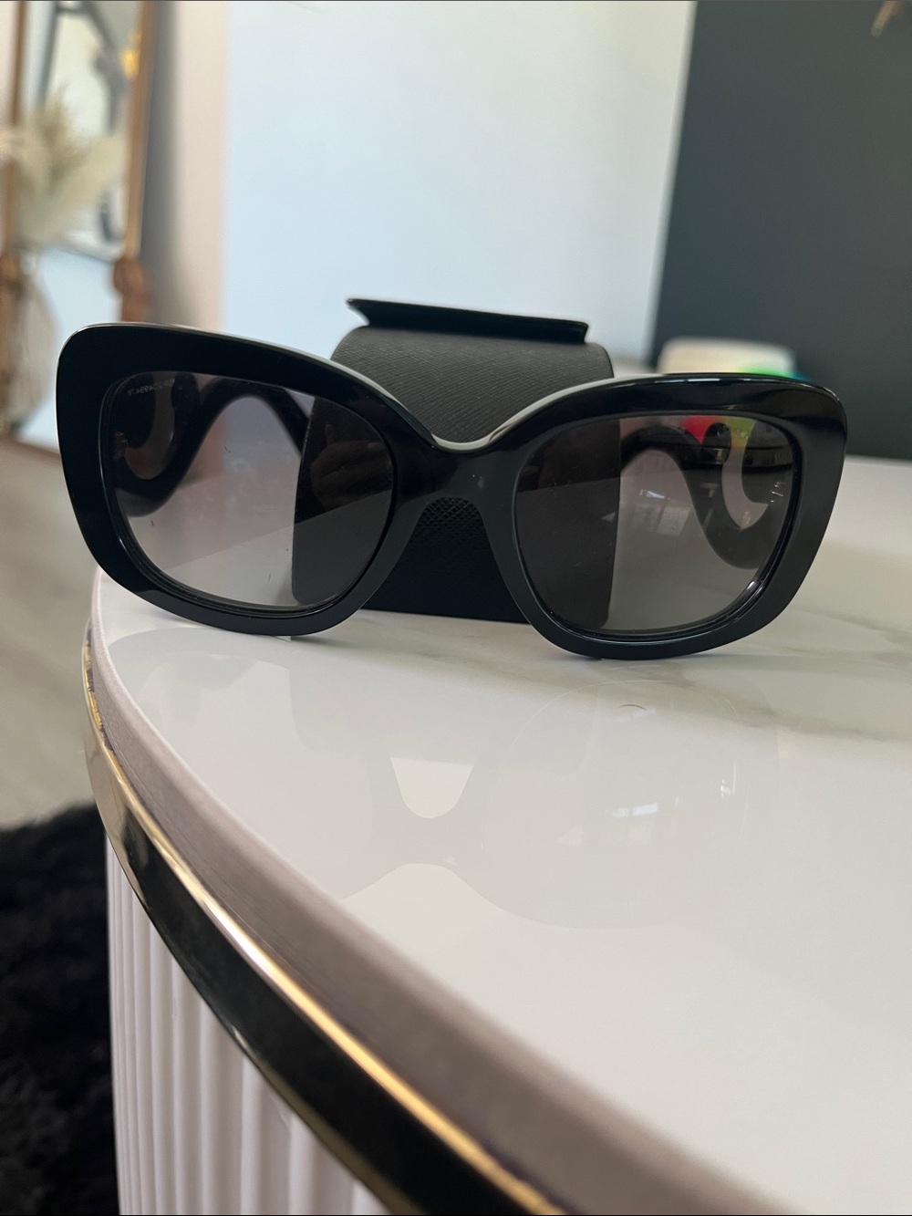 Prada Black Cat-Eye Sunglasses with Dark Lenses